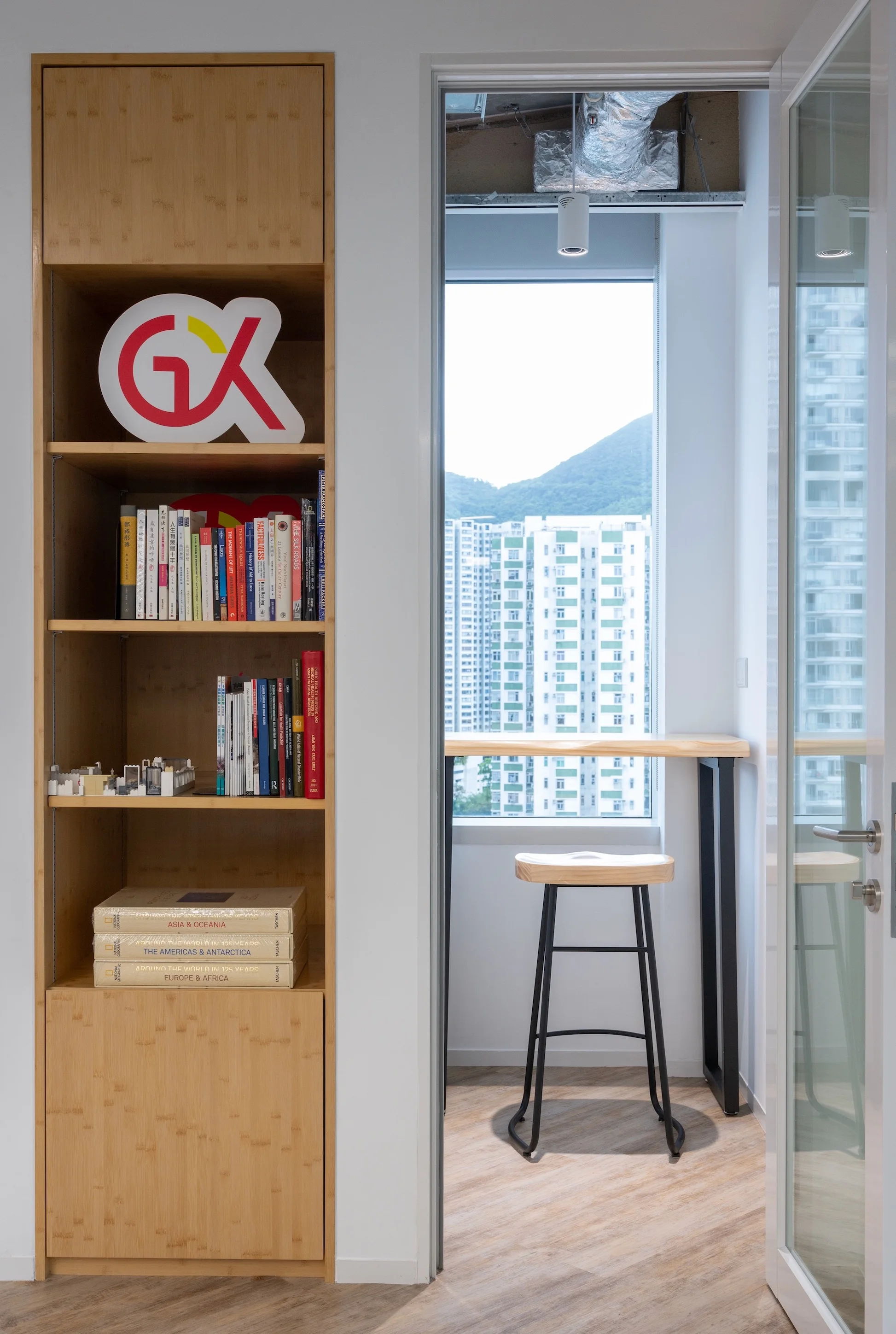 Efficient phone booth and bookshelf feature